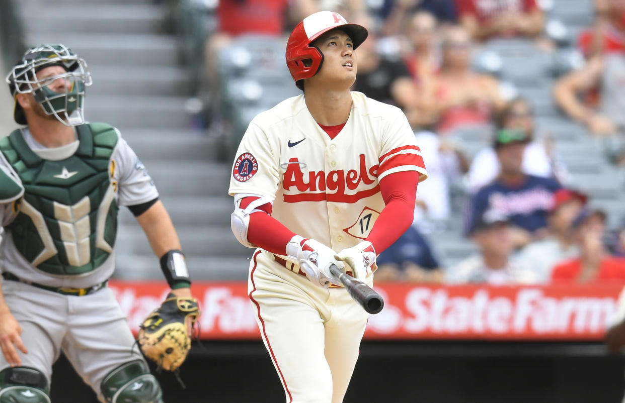 ANAHEIM, CA - AUGUST 04: Stephen Vogt #21 of the Oakland Athletics looks on as Shohei Ohtani #17 of the Los Angeles Angels watches his home run leave the park in the seventh inning at Angel Stadium of Anaheim on August 4, 2022 in Anaheim, California. (Photo by John McCoy/Getty Images)