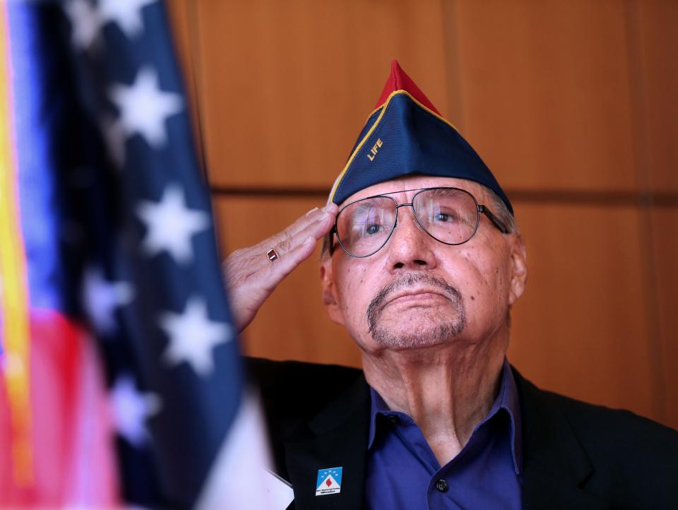 George Banda Army veteran who served in the Vietnam War, salutes flag during  a ceremony to recognize the completion of  the  outdoor grounds, where the sunken tree grove was replaced with new trees, a lawn accessible to people with disabilities and a new war memorial on Monday,  Nov. 14, 2022.