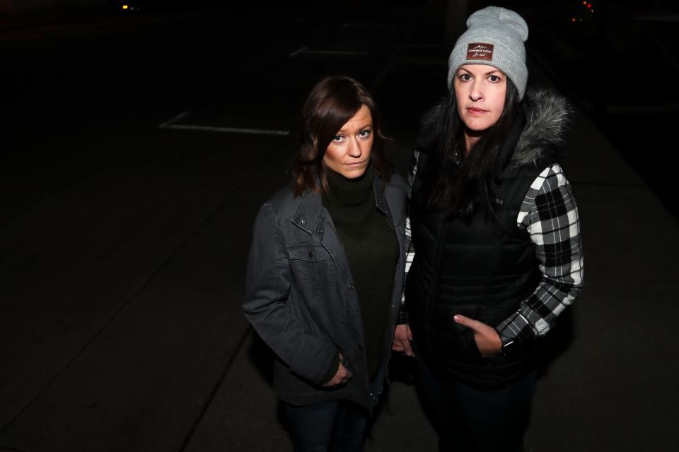 Robin Frievalt, left, and her partner Lauren Janke, right, stand in the exact spot where they were watching the Waukesha Christmas Parade on Sunday, Nov. 21, 2021. "I see their faces, the eyes of everyone I tried to connect with and help," Frievalt said.