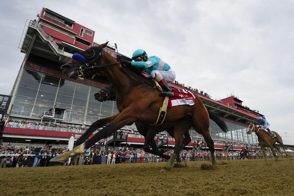 National Treasure, with jockey John Velazquez, edges out Blazing Sevens, with jockey Irad Ortiz Jr., to win the148th running of the Preakness Stakes horse race at Pimlico Race Course, Saturday, May 20, 2023, in Baltimore. (AP Photo/Julio Cortez)
