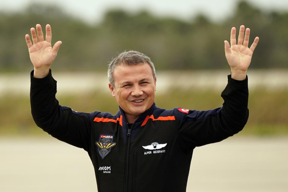 Axiom-3 mission specialist Alper Gezeravci, of Turkey, waves to family members as he arrives, Thursday, Jan. 18, 2024, at the Kennedy Space Center in Cape Canaveral, Fla., to prepare for this afternoons launch to the International Space Station. (AP Photo/John Raoux)