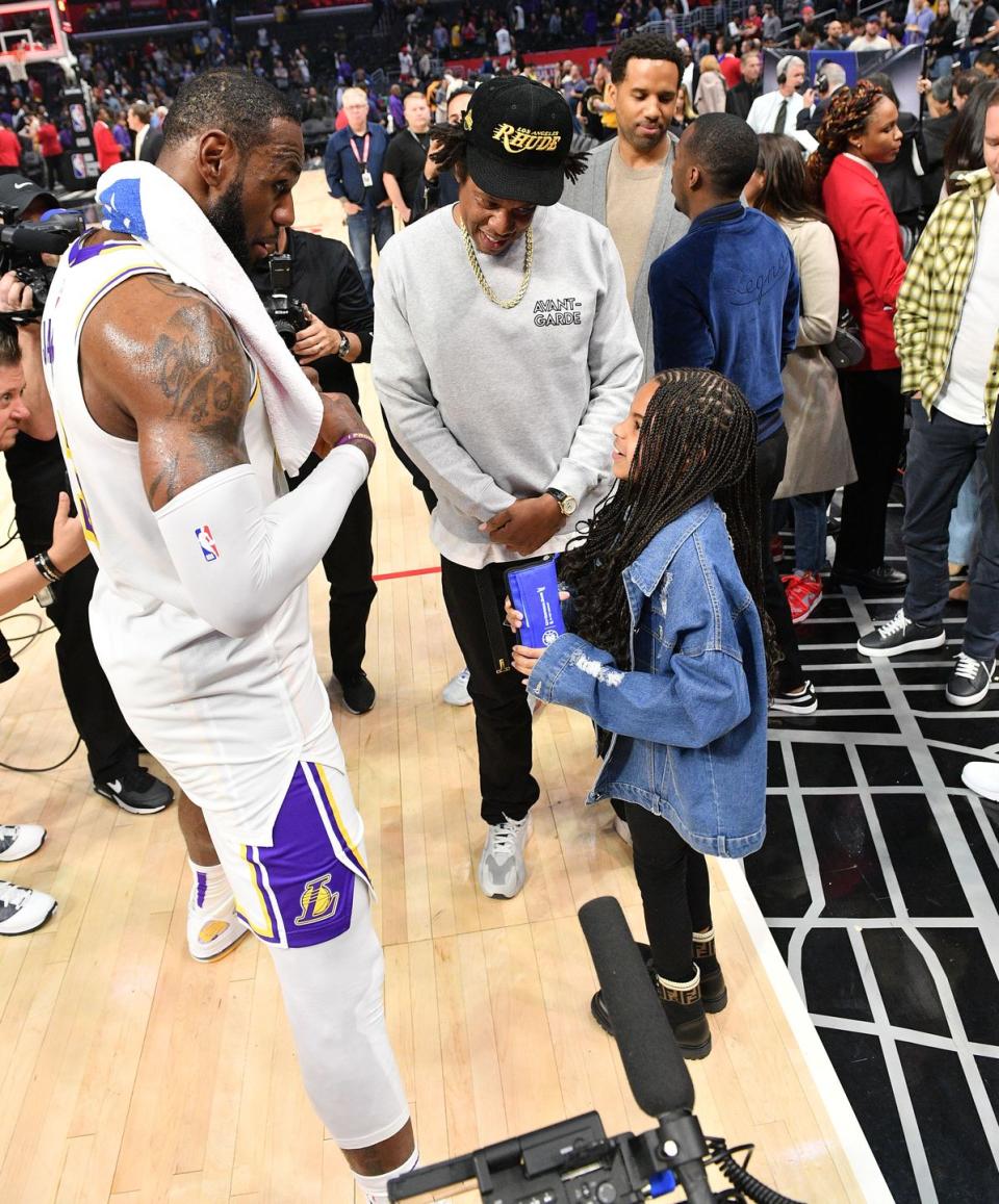 <p>Earning some major dad points, Jay-Z introduces his daughter, Blue Ivy, to NBA star Lebron James after attending a game together in 2020. </p>