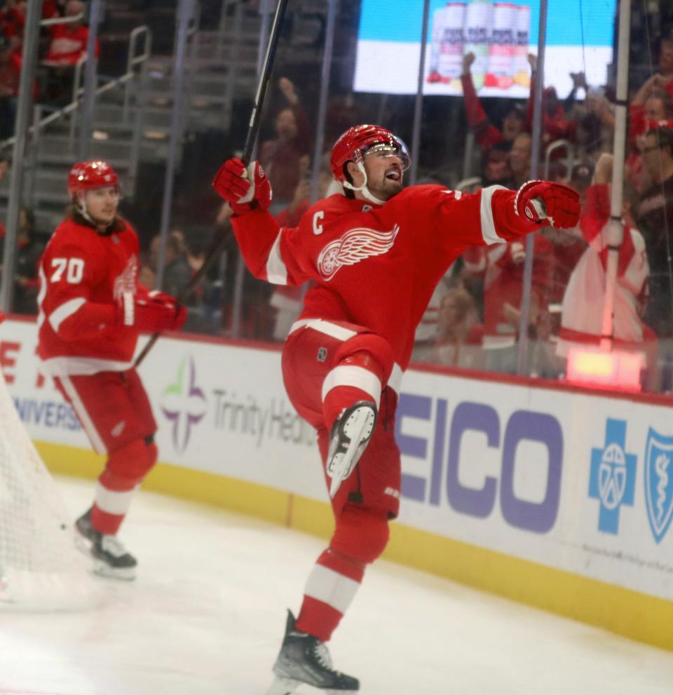 Red Wings center Dylan Larkin celebrates after a goal against Ducks goaltender John Gibson during the first period of the Wings' 5-1 win over the Ducks on Sunday, Oct. 23, 2022, at Little Caesars Arena.