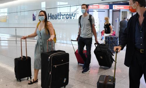 Passengers arrive at Heathrow Airport in London