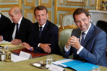 French President Emmanuel Macron, French Interior Minister Christophe Castaner and French Foreign Affairs Minister Jean-Yves Le Drian attend a meeting at the Elysee Palace in Paris