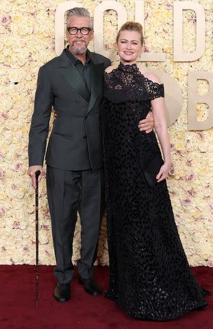 <p>Kevin Mazur/Getty </p> Alan Ruck and Mireille Enos attend the 81st Annual Golden Globe Awards