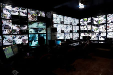 Barangay workers monitor CCTV video monitors at Barangay Bagong Silangan office, in Quezon City, Metro Manila, Philippines November 22, 2017. REUTERS/Erik De Castro