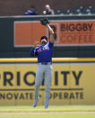 Texas Rangers second baseman Marcus Semien catches the pop up hit by Detroit Tigers' Parker Meadows during the second inning of a baseball game, Tuesday, April 16, 2024, in Detroit. (AP Photo/Carlos Osorio)