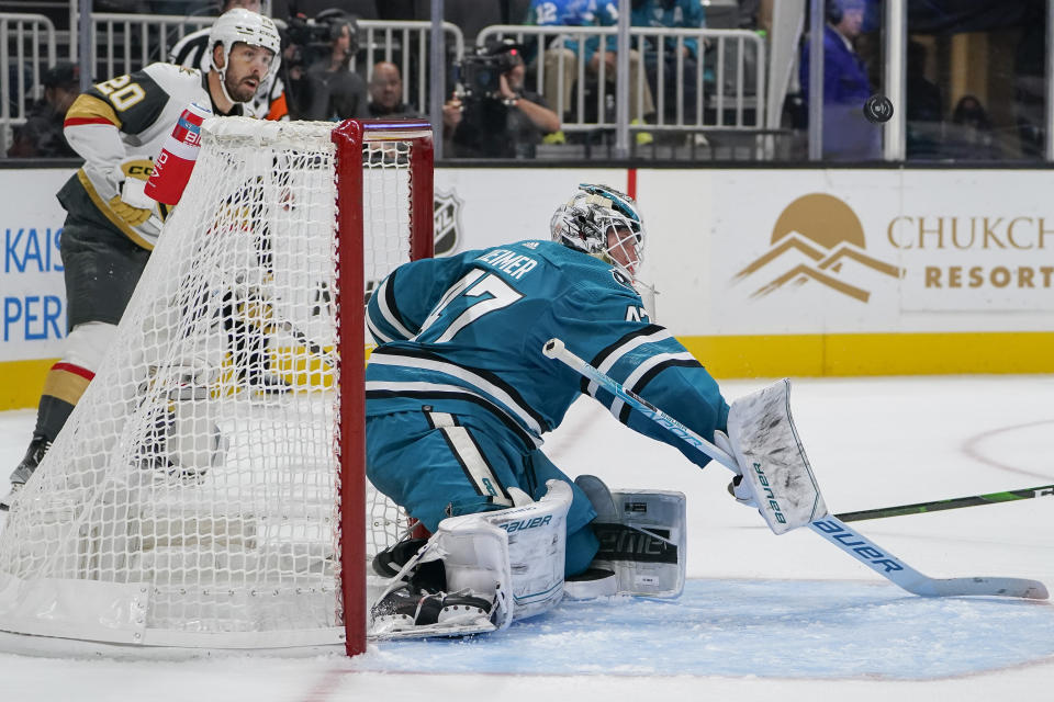 San Jose Sharks goaltender James Reimer (47) deflects a shot against the Vegas Golden Knights during the second period of an NHL hockey game in San Jose, Calif., Tuesday, Oct. 25, 2022. (AP Photo/Godofredo A. Vásquez)