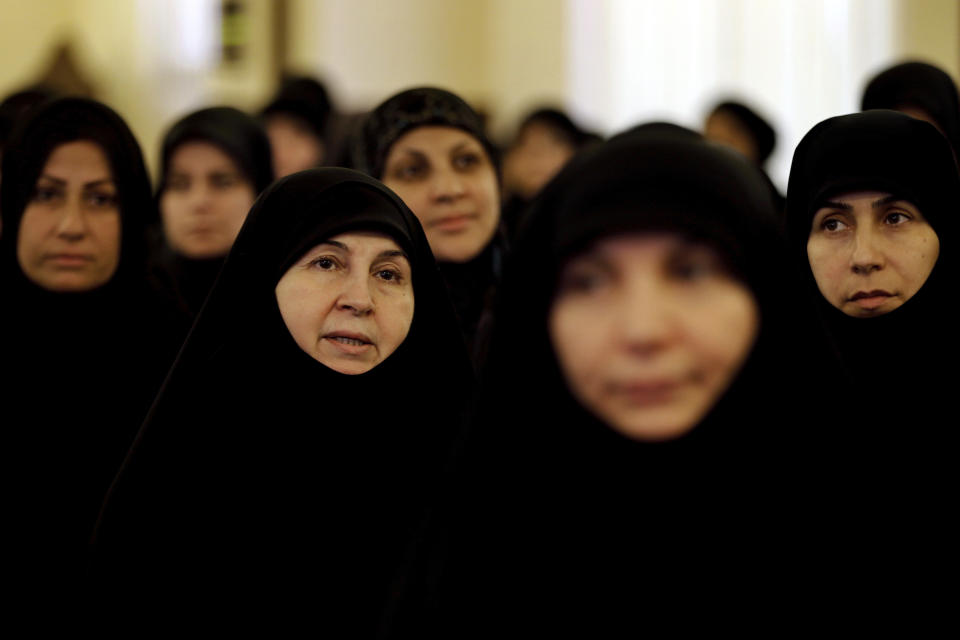 Supporters of the Iranian-backed Hezbollah group listen to a speech of Hezbollah leader Sayyed Hassan Nasrallah, via a video link, in a southern suburb of Beirut, Lebanon, Friday, March 8, 2019. Nasrallah called on his supporters to donate funds to the group as it comes under tighter sanctions from western countries. (AP Photo/Bilal Hussein)