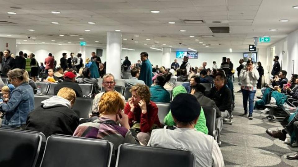 Assignment Freelance Picture Malaysian Airlines passengers who were forced to disembark their\n plane after it returned to Sydney Airport wait inside Sydney Airport.\n Picture: Supplied.