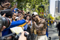 Golden State Warriors' Gary Payton II celebrates with fans during the NBA Championship parade in San Francisco, Monday, June 20, 2022, in San Francisco. (AP Photo/John Hefti)