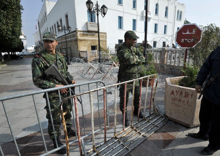 Tunisian soldiers stand guard as Prime Minister Hamadi Jebali meets with his cabinet on February 19, 2013, in Tunis, ahead of the prime minister's resignation. Tunisia was plunged into its worst political crisis since the 2011 Arab Spring revolt that ousted President Zine El Abidine Ben Ali when leftist politician Chokri Belaid was shot dead outside his home in Tunis on February 6