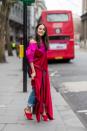 <p>A LFW guest looks chic stepping out of a show. [Photo: Timur Emek/Getty Images] </p>