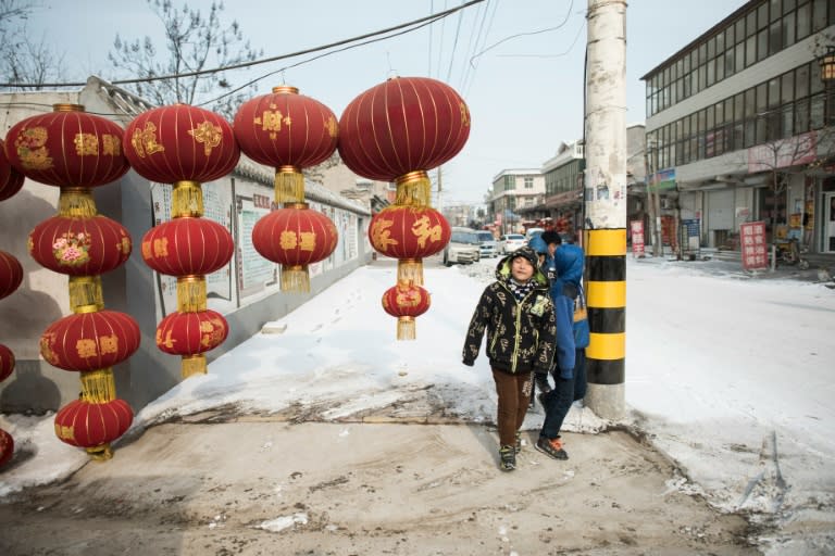 Red lanterns are hung outside a factory in the village of Tuntou, in Hebei province southwest of Beijing