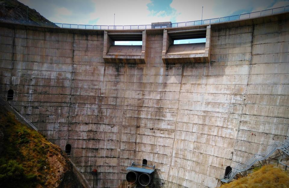 Low-angle view of water reservoir wall