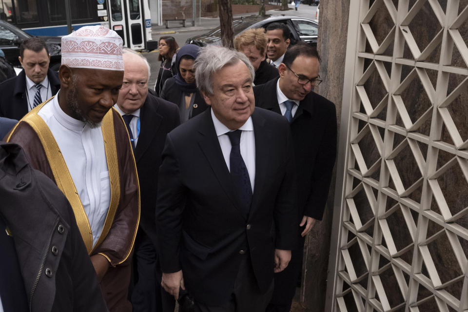 Sheik Saad Jalloh, left, imam of the Islamic Cultural Center, walks with United Nations Secretary General Antonio Guterres as he arrives for a service in New York, Friday, March 22, 2019 in the wake of a white supremacist's deadly shooting spree on two mosques, March 15, in Christchurch, New Zealand. (AP Photo/Mark Lennihan)