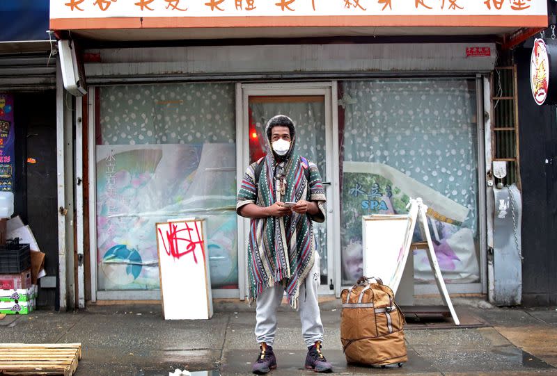 A man wears a mask in Chinatown in New York