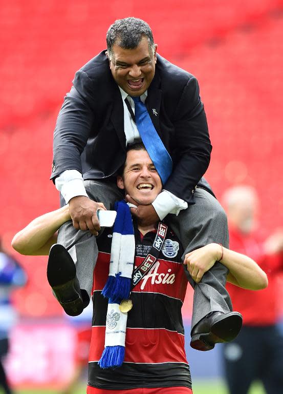 Queens Park Rangers player Joey Barton carries Tony Fernandes on his shoulders after QPR won the English Championship Play Off final against Derby County at Wembley Stadium in London on May 24, 2014