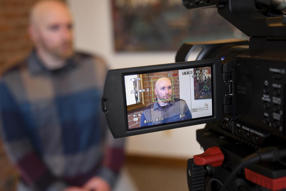 Scott Verti sits for an interview in downtown Denver on Wednesday, Jan. 18, 2023. Verti has filed a lawsuit alleging about 100 instances of abuse at St. Elizabeth Ann Seton Church in Fort Collins, Colo., from 1998 to 2003. The lawsuit is allowed under a 2021 state law that opened up a three-year window for people to pursue litigation for sexual abuse that happened to them as children dating as far back as 1960.(AP Photo/Thomas Peipert)