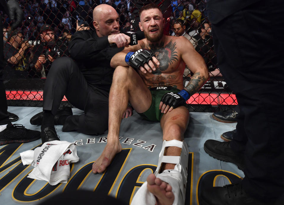 Conor McGregor is interviewed by Joe Rogan after his TKO loss to Dustin Poirier in their welterweight fight at UFC 264 on Saturday. (Jeff Bottari/Zuffa LLC)