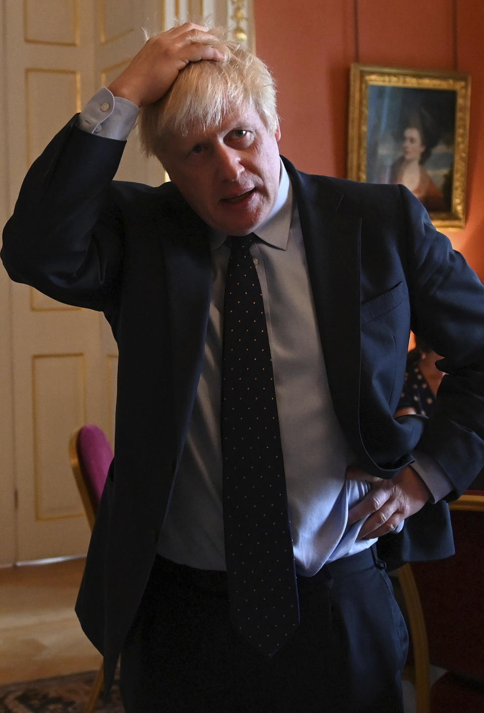 Britain's Prime Minister Boris Johnson speaks with NHS workers during a reception at 10 Downing Street, London, Tuesday, Sept. 3, 2019. Britain's opposition leader has attacked Prime Minister Boris Johnson for trying to run a "cabal" from Downing Street in order to take Britain out of the European Union without a deal despite the costs. (Daniel Leal-Olivas/Pool Photo via AP)