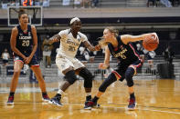 Connecticut guard Paige Bueckers (5) drives against Butler guard Upe Atosu (21) during the second quarter of an NCAA college basketball game in Indianapolis, Saturday, Feb. 27, 2021. (AP Photo/Michael Conroy)