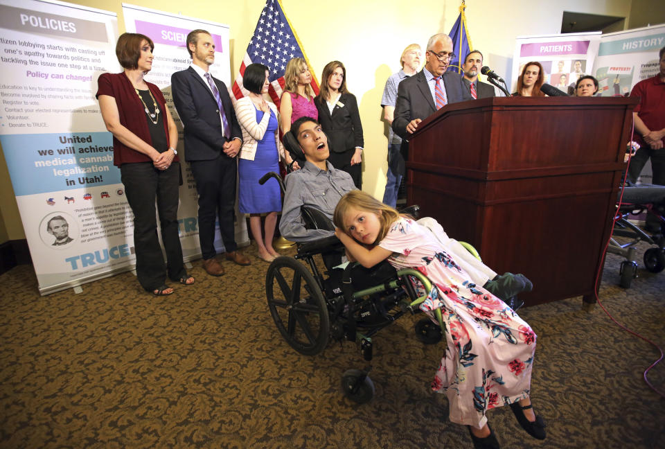 In May 2018, Willow Hennessy sits on the wheelchair of her adopted brother Hestevan, who has cerebral palsy and suffers from chronic nerve pain, during a news conference at the Utah state Capitol, as supporters of a medical-marijuana ballot initiative fend off opponents' efforts to keep them off the ballot. (Photo: Rick Bowmer/AP)