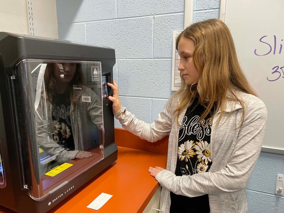 Fiona Ciobanu, 11, explored wind energy, but had a few problems learning the ins and outs of 3D printing when her project broke. Not to be deterred, she demonstrates what she’s learned in the “NRG” STEM program at Farragut Intermediate School, May 9, 2024.