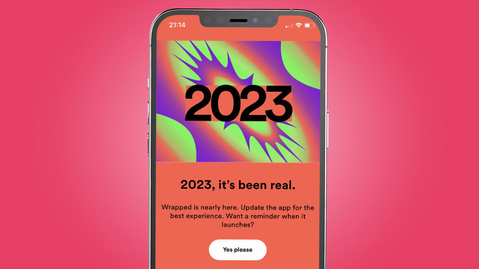 An iPhone on a pink background showing the Spotify Wrapped 2023 teaser