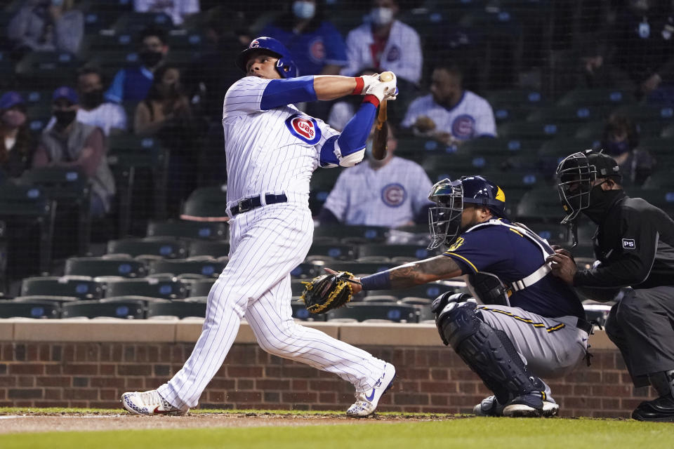 Chicago Cubs' Willson Contreras hits a two-run home run against the Milwaukee Brewers during the fourth inning of a baseball game, Monday, April 5, 2021, in Chicago. (AP Photo/David Banks)