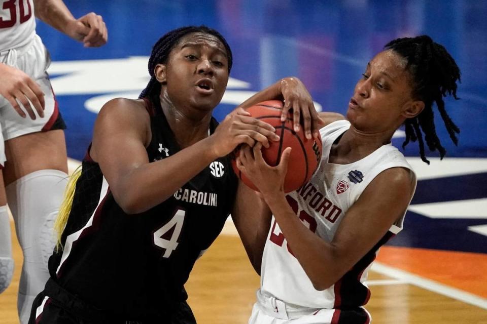 South Carolina forward Aliyah Boston (4) fights for possession of the ball with Stanford guard Kiana Williams, right, during the first half of a women’s Final Four NCAA college basketball tournament semifinal game Friday, April 2, 2021, at the Alamodome in San Antonio.