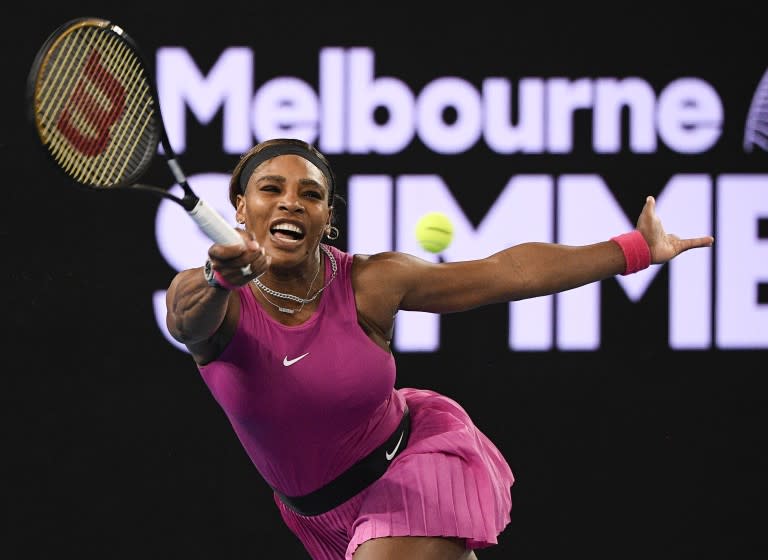 United States' Serena Williams makes a forehand return to compatriot Danielle Collins during a tuneup.