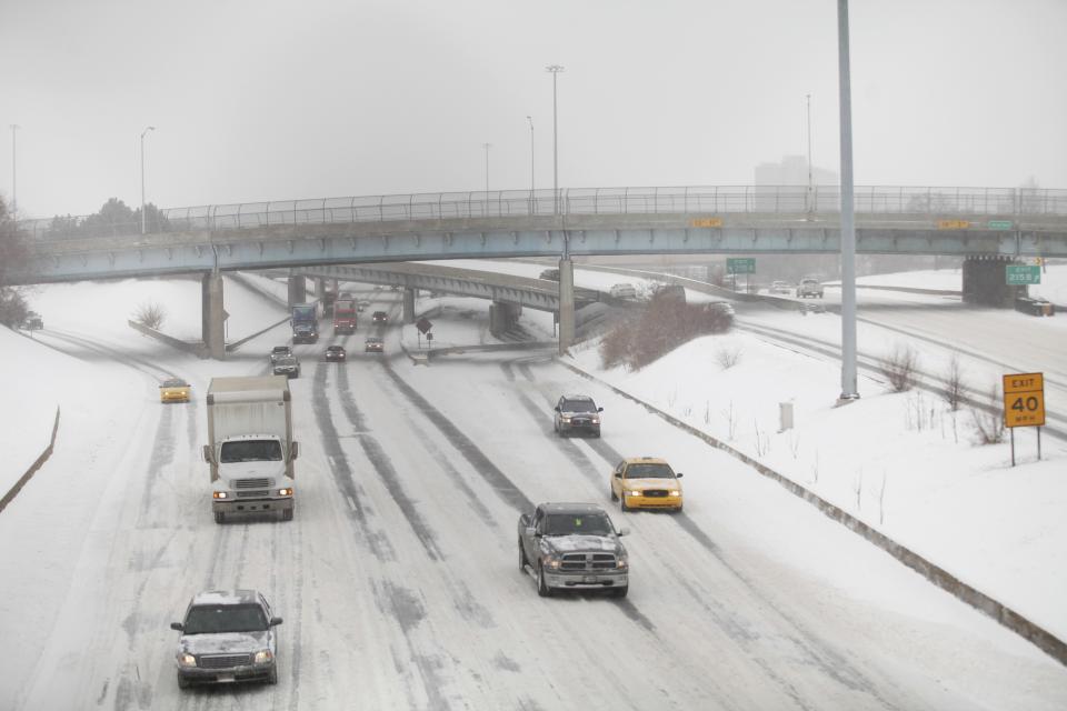 Motorist drive along a snow covered Interstate-94 in Detroit