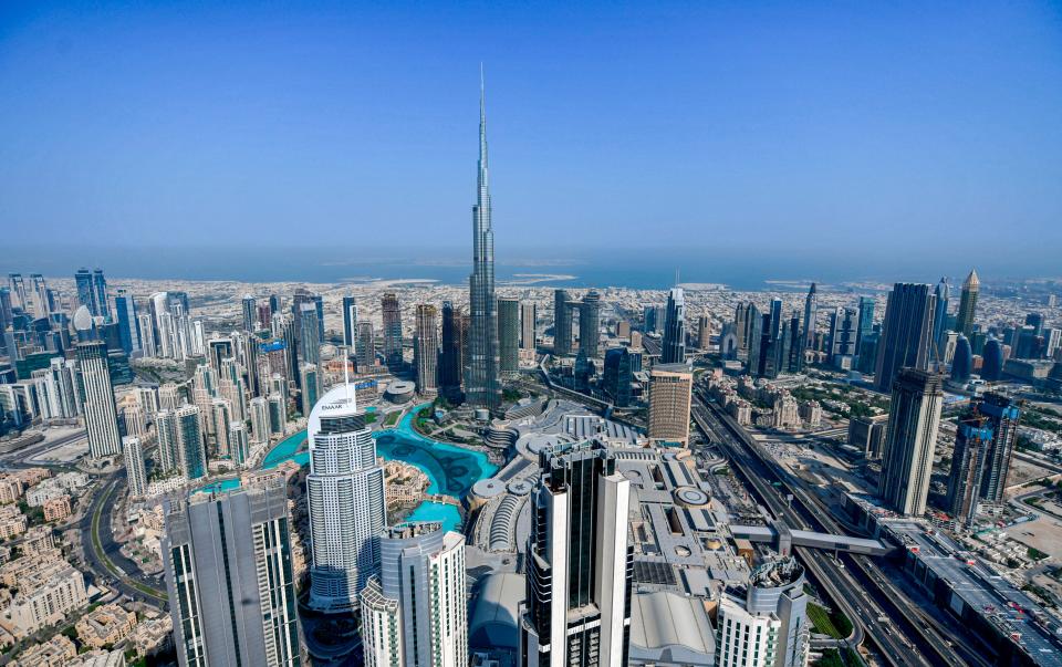 This picture taken on July 8, 2020 shows an aerial view of the Burj Khalifa skyscraper, the tallest structure and building in the world, in the Gulf emirate of Dubai, during a government-organised helicopter tour.