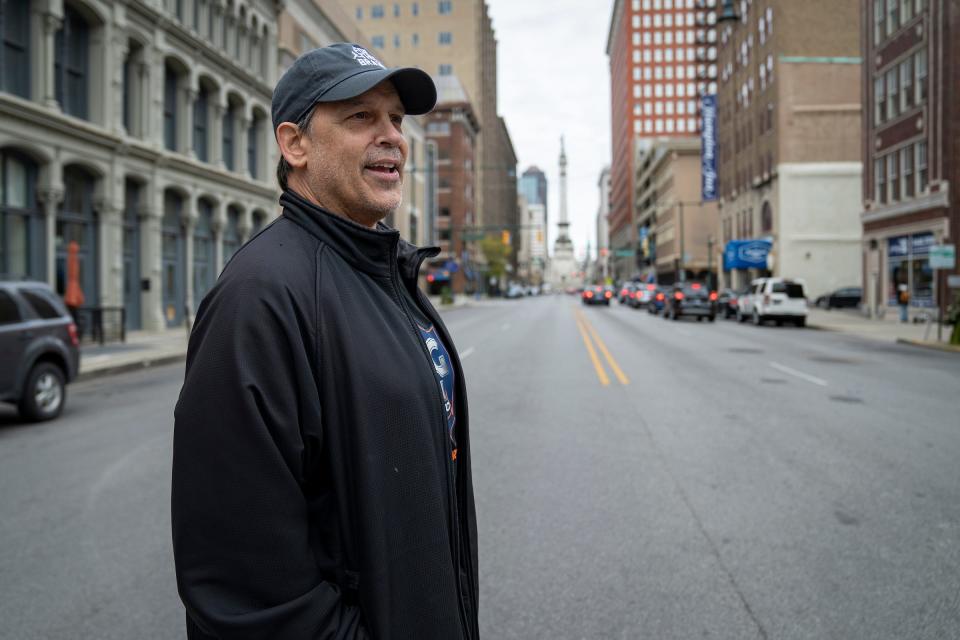 Mike Jansen, former longtime stadium announcer for the Indianapolis Colts, walks through downtown Indianapolis before an interview with IndyStar on Thursday, Oct. 20, 2022. After a 24-season career announcing Colts games at Lucas Oil Stadium, the team unexpectedly dismissed him in September. 