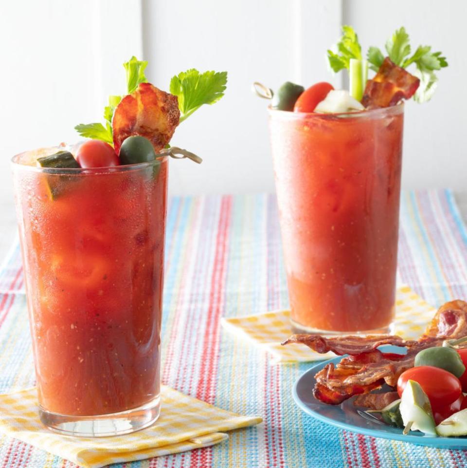 easter brunch ideas classic bloody mary with plate of garnishes