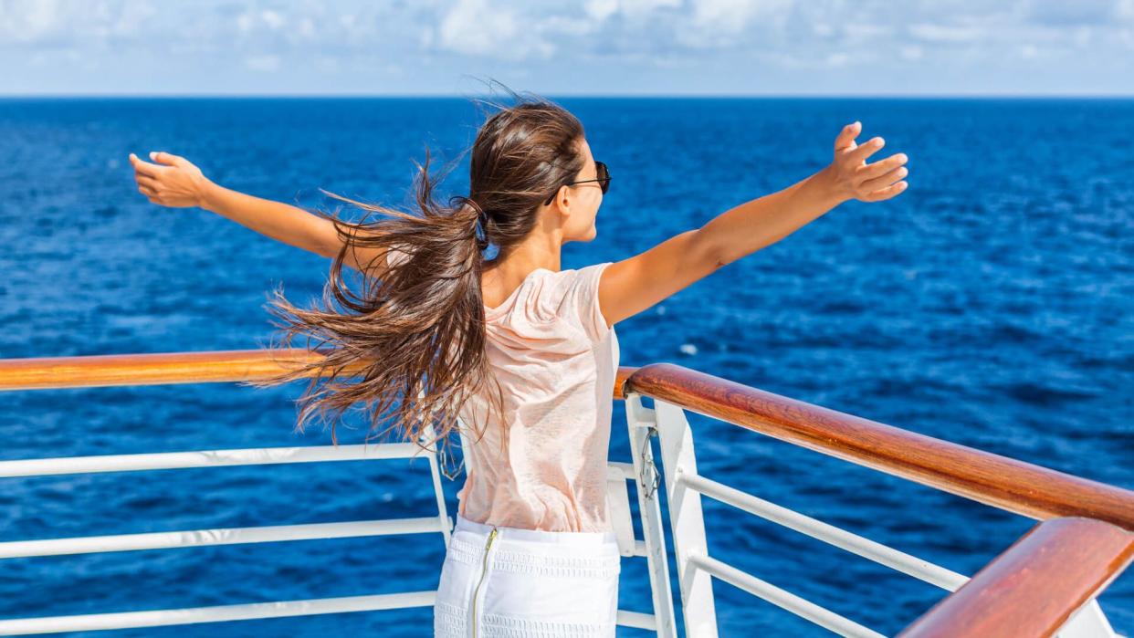 Cruise ship vacation woman enjoying travel vacation at sea.