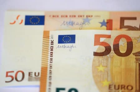 FILE PHOTO: The signature of the President of the European Central Bank (ECB), Mario Draghi, is seen on the new 50 euro banknote during a presentation by the German Central Bank (Bundesbank) at its headquarters in Frankfurt, Germany, March 16, 2017.      REUTERS/Kai Pfaffenbach