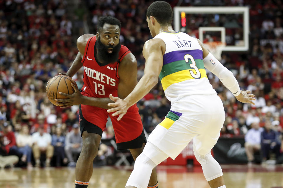 HOUSTON, TEXAS - FEBRUARY 02: James Harden #13 of the Houston Rockets controls the ball defended by Josh Hart #3 of the New Orleans Pelicans in the first half at Toyota Center on February 02, 2020 in Houston, Texas.  NOTE TO USER: User expressly acknowledges and agrees that, by downloading and or using this photograph, User is consenting to the terms and conditions of the Getty Images License Agreement. (Photo by Tim Warner/Getty Images)