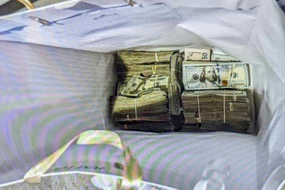 Cash from a bag left with a juror in a fraud case in Minneapolis on June 2, 2024.  (U.S. Attorney's Office for Minnesota via AP)