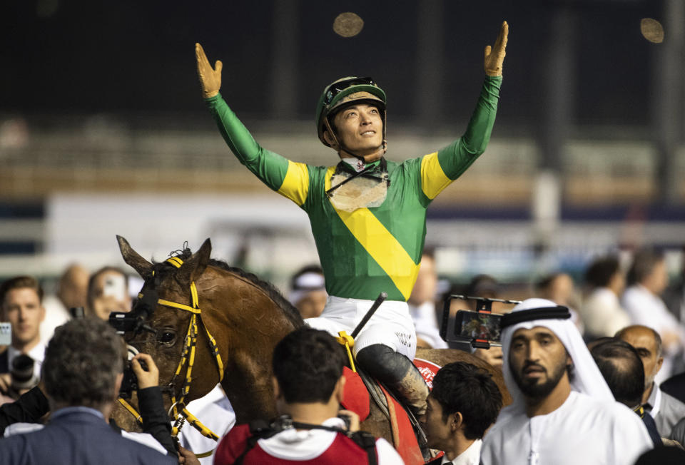 Ushba Tesoro's jockey Yuga Kawada reacts after winning the $12 million Group 1 Dubai World Cup over 2000m (10 furlongs) at the Meydan racecourse in Dubai, United Arab Emirates, Saturday, March 25, 2023. (AP Photo/Martin Dokoupil)