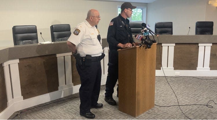 Upper Makefield police Chief Mark Schmidt (left) and fire Chief Tim Brewer at press conference in the township building to say a fourth victim was found in Hough’s Creek raising the death toll from Saturday’s flooding to four.