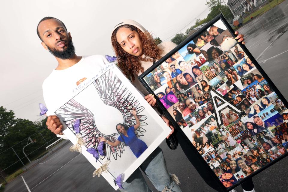 Family members Jonathan Rodrigues and jarah Rodrigues hold photographs of the late Ashley Cardoso at East Middle School in Brockton on Saturday, June 3, 2023.