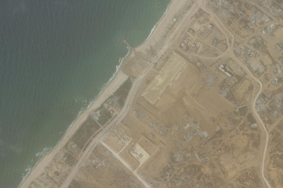 This satellite picture taken by Planet Labs PBC show the construction of a new aid port near Gaza City, Gaza Strip, on April 18, 2024. A new port is being built in the Gaza Strip ahead of a U.S. military-led operation to surge needed food and other aid into the besieged enclave as Israel's war on Hamas there grinds on, according to satellite images analyzed by Thursday, April 25, 2024, by The Associated Press. (Planet Labs PBC via AP)