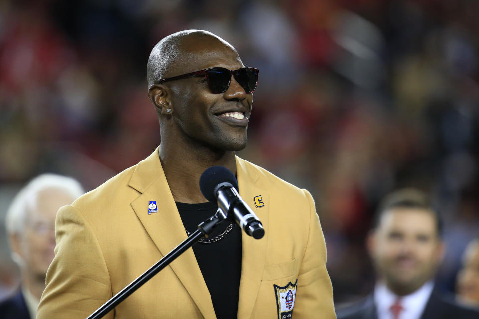 Terrell Owens donned his gold jacket and stood by his bust, and expressed no regret about skipping Canton. (Getty)