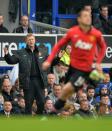 Manchester United manager David Moyes (L) gestures during the English Premier League match against Everton at Goodison Park in Liverpool on April 20, 2014