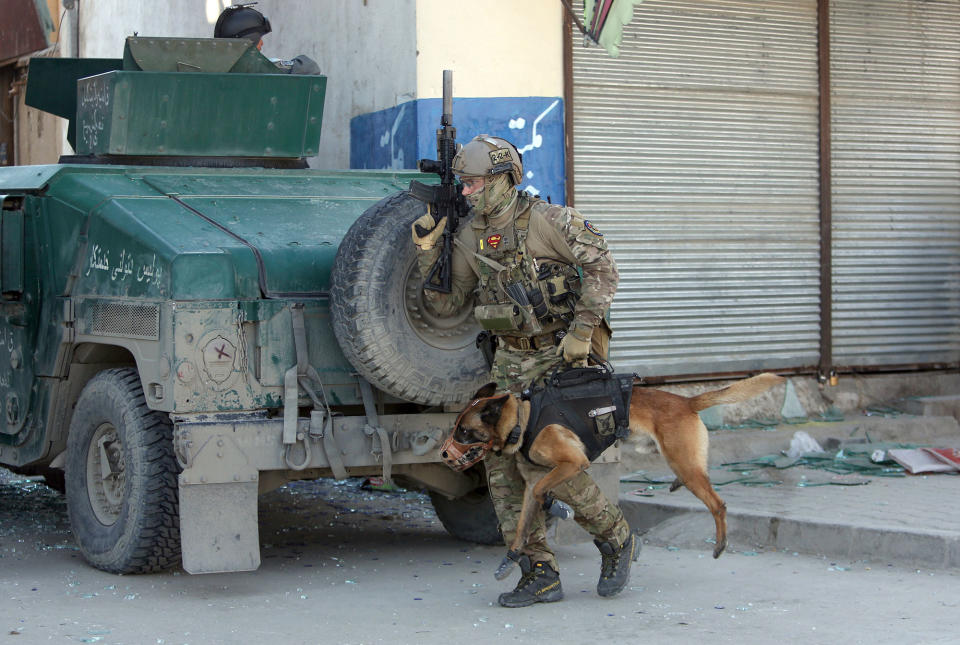 <p>A foreign soldier arrives with his dog on the scene after a suicide bombing in Kabul, Afghanistan, Wednesday, March 1, 2017. A pair of suicide bombings, both claimed by the Taliban, struck the Afghan capitall, an Afghan official said. (AP Photo/Rahmat Gul) </p>