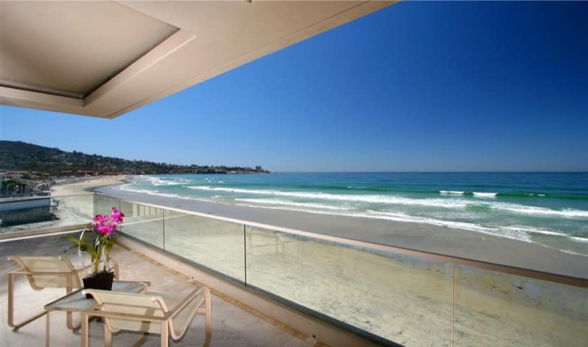 Spanning 9,300 square feet, the three-story home overlooking the ocean expands to 50 feet of beach.