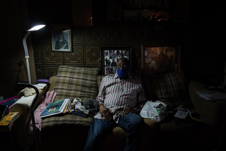 Carleton Smith sits on the couch of his mother's home in St. Louis on Friday, May 21, 2021. Smith, a cousin of Craig Elazer, found him dead after a fentanyl overdose in September. He looked through the mail slot and saw him lying there. (AP Photo/Brynn Anderson)